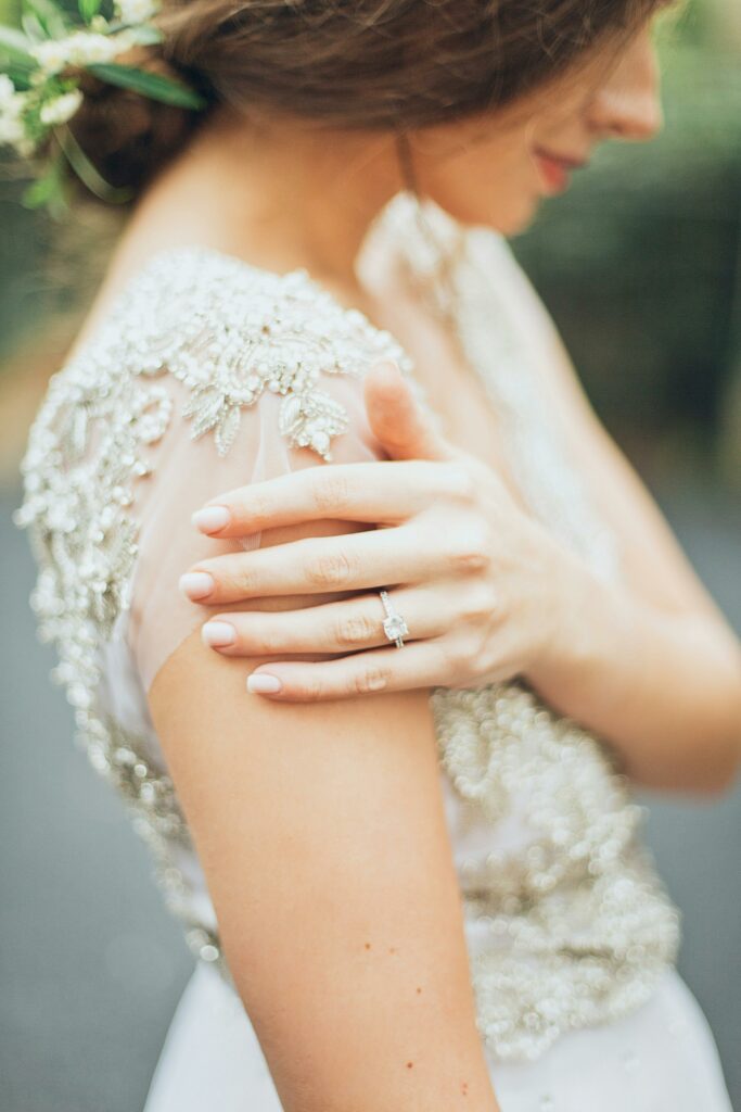 bride wearing diamond wedding ring