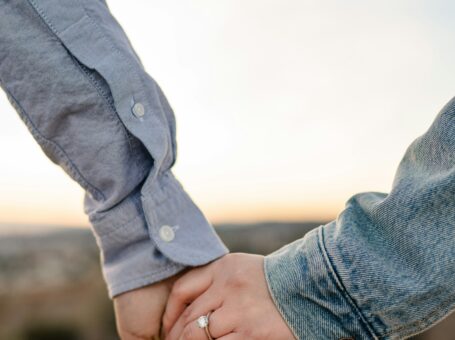 Couple showing enngagement ring